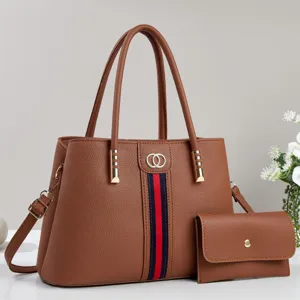 Elegant brown leather tote bag set with matching wallet, classic striped accent and double handles.