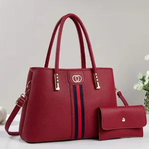 Red litchi pattern women's two-piece tote bag set with matching wallet and shoulder strap.