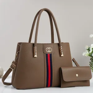 Detailed view of brown litchi grain women tote handbag set with stripe and double rings.