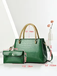 Green crocodile pattern patent leather handbag with metallic braided handle and stylish coin purse.