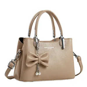 Elegant khaki women handbag PU leather tote bag with bowknot pearl pendant for daily commute.