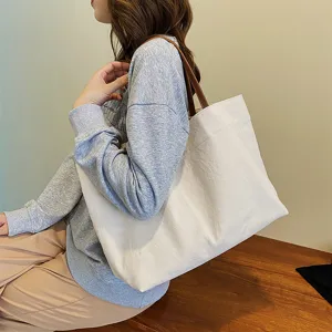 Large capacity canvas tote bag for women, minimalist casual shoulder bag for daily commuting.