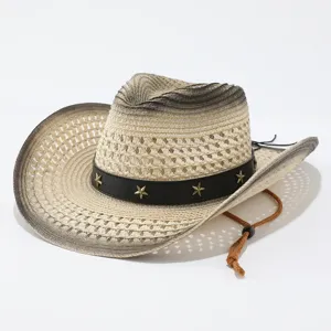 Close-up view of the woven straw cowboy hat featuring gradient color, star studs, and chin strap.