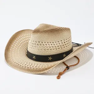 Close-up detail of the woven straw cowboy hat featuring a black star-studded band and cord.
