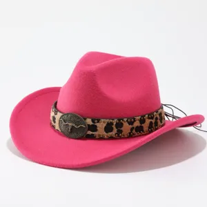 Close-up of the stylish pink felt cowboy hat with leopard print band and metal bull skull decor.