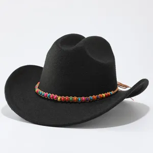 Close-up detail of black felt western cowboy hat with colorful beaded decorative rope band.