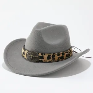 Detail shot of grey felt cowboy hat with leopard print band and metal bull skull buckle.