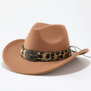 Western style brown wool felt cowboy hat with leopard print band and metal bull skull decor.