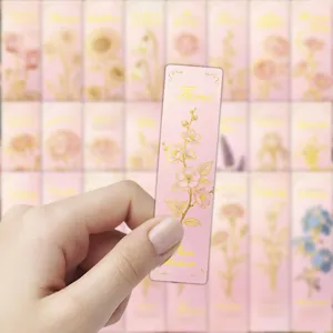Pink floral paper bookmark with gold foil design, cute aesthetic stationery for reading.