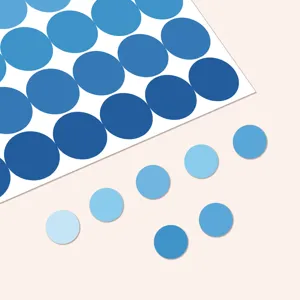 Close-up detail of blue gradient round dot index marker stickers, perfect for notebook and file organization.