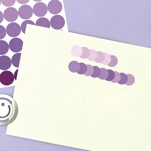 Close-up detail view of macaron colored round dot index sticky notes for journaling & planning.
