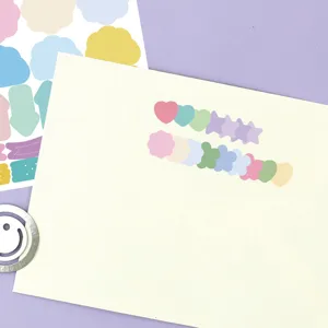 Macro detail of cute pastel memo stickers set featuring heart and star shapes for journaling.