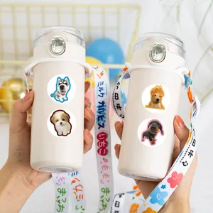 Cute cartoon dog stickers portable plastic water bottle with adjustable strap for kids and daily use.