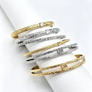 Exquisite titanium steel cuff bracelet with intricate floral scroll engraving and crystal accents.