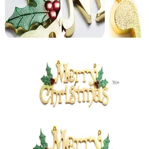 Golden Merry Christmas hanging sign detail, festive tree decor with glitter and leaves.
