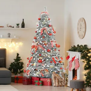 Artificial snow-flocked Christmas tree with red ornaments and gift boxes in living room scene detail