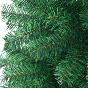 Artificial Christmas tree lush green PVC branches close up holiday decoration festive pine tree