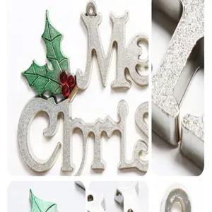 Christmas hanging ornament detail view showing glitter metal letters and holiday holly leaves.