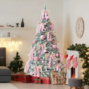 Flocked Christmas tree detail scene with pink ornaments and bows for holiday home decor.