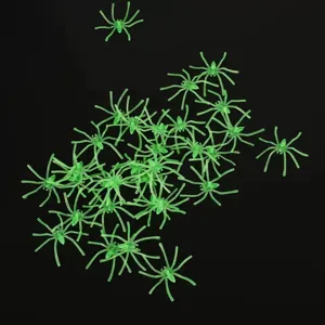 Mini glow plastic spiders for Halloween party decoration and spooky scene setup props.