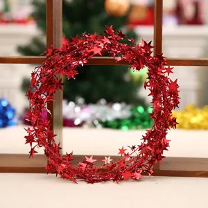 Red Christmas tinsel garland with shiny star decorations, perfect for holiday home party decor.