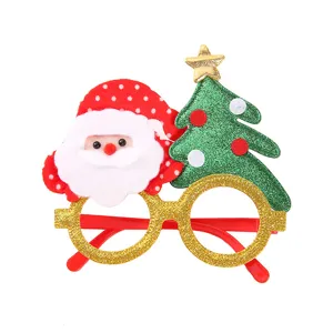 Occhiali decorativi di Natale dettaglio primo piano, design festivo Babbo Natale e albero festa.