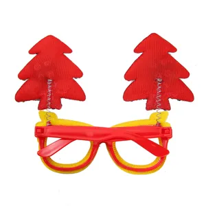 Occhiali novita albero di natale con alberi rossi a molla per festa e oggetti di scena foto.
