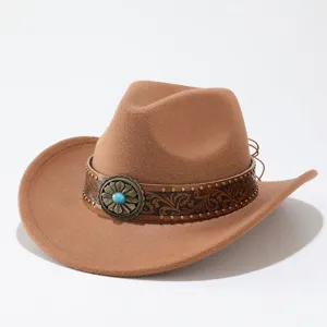 Detail of vintage brown wool cowboy hat with tooled leather band and turquoise stone concho.