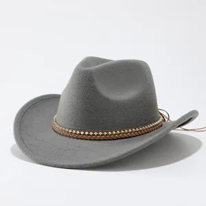 Grey felt western cowboy hat detail showing braided leather and metallic beaded decorative band.