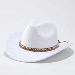 Detail shot of white western cowboy hat, braided brown leather and beaded band, curved brim.