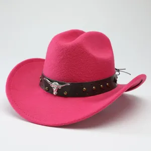 Pink western cowboy hat with metal bull skull emblem and brown leather strap detailed.