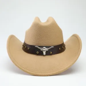 Detail view of the western cowboy hat with leather band and metal bull head decoration.