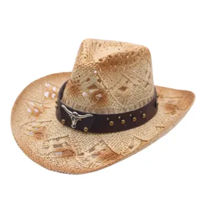 Detailed view of straw cowboy hat with leather band and metal bull skull emblem for men and women