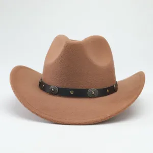 Close-up detail of the brown western cowboy hat showing the black studded band and felt texture.