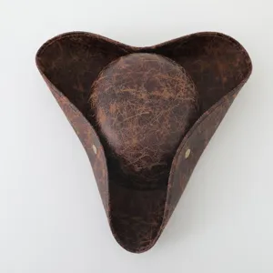 Detailed close-up of brown distressed faux leather tricorn pirate hat with metallic snap buttons.
