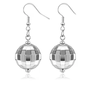 Silver disco ball dangle earrings closeup detail, 70s retro style metallic mirror spherical drop jewelry.