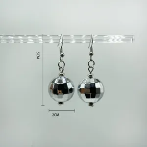 Silver mirror disco ball drop earrings, 70s retro style party fashion jewelry detail view.