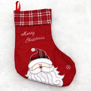 Christmas stocking detail red fabric checkered cuff Santa embroidery festive holiday decor