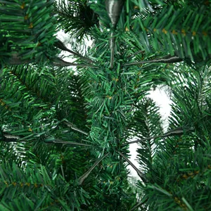 Artificial Christmas tree detail view, dense PVC flame-retardant green branches and needles.