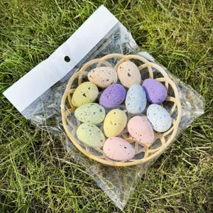 Detailed view of colorful speckled Easter eggs in basket, perfect for holiday decoration.