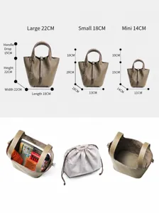 Genuine leather bucket bag with top handle, available in multiple sizes with spacious interior design.