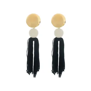 Bohemian long gold disc white bead black tassel dangle earrings for women elegant jewelry detail view.