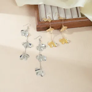 Elegant metal flower leaf long dangling earrings in gold and silver for women fashion styles.