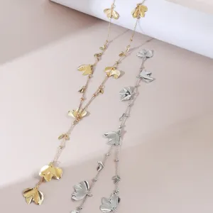 Detailed view of fashion metal flower leaf pendant necklace jewelry closeup display shot