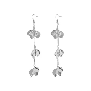 Close-up detail shot of long silver metal flower petal dangling earrings with delicate chain links.