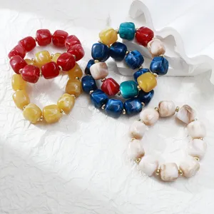 Colorful acrylic geometric bead stretch bracelets set, stylish fashion accessory detail view.