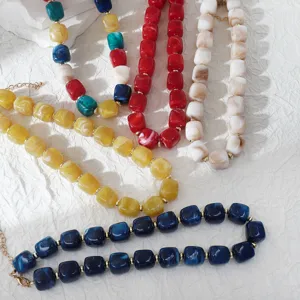 Detailed view of colorful acrylic block beaded necklaces, showcasing fashion bohemian style jewelry.