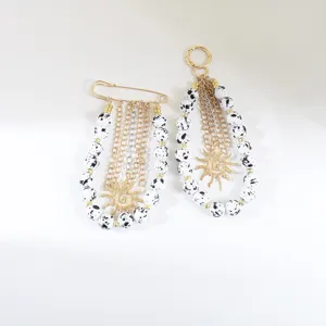 Breloque de sac en perles dalmatiote porte-clés fait main avec pendentif soleil.