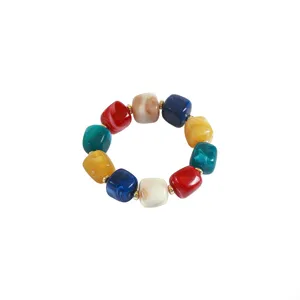 Colorful acrylic resin block bead bracelet detail showcasing vibrant marble patterns.