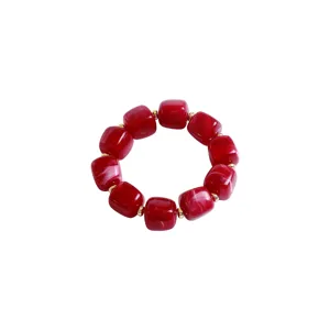 Chunky red marbled acrylic bead bracelet with gold spacers, stylish detail view for women.